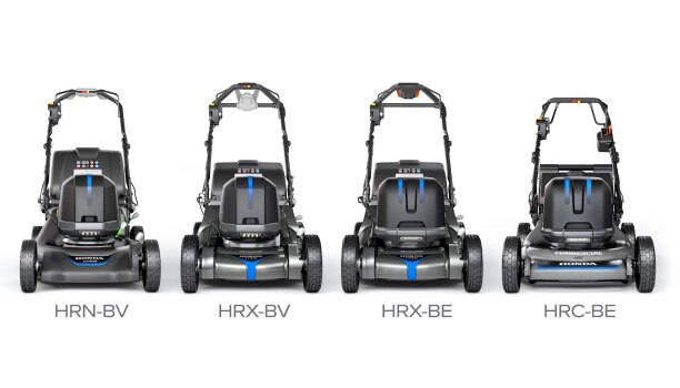 A lineup of Honda battery-powered lawn mowers against a green lawn. 