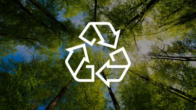 A white recycling icon against a forest. 